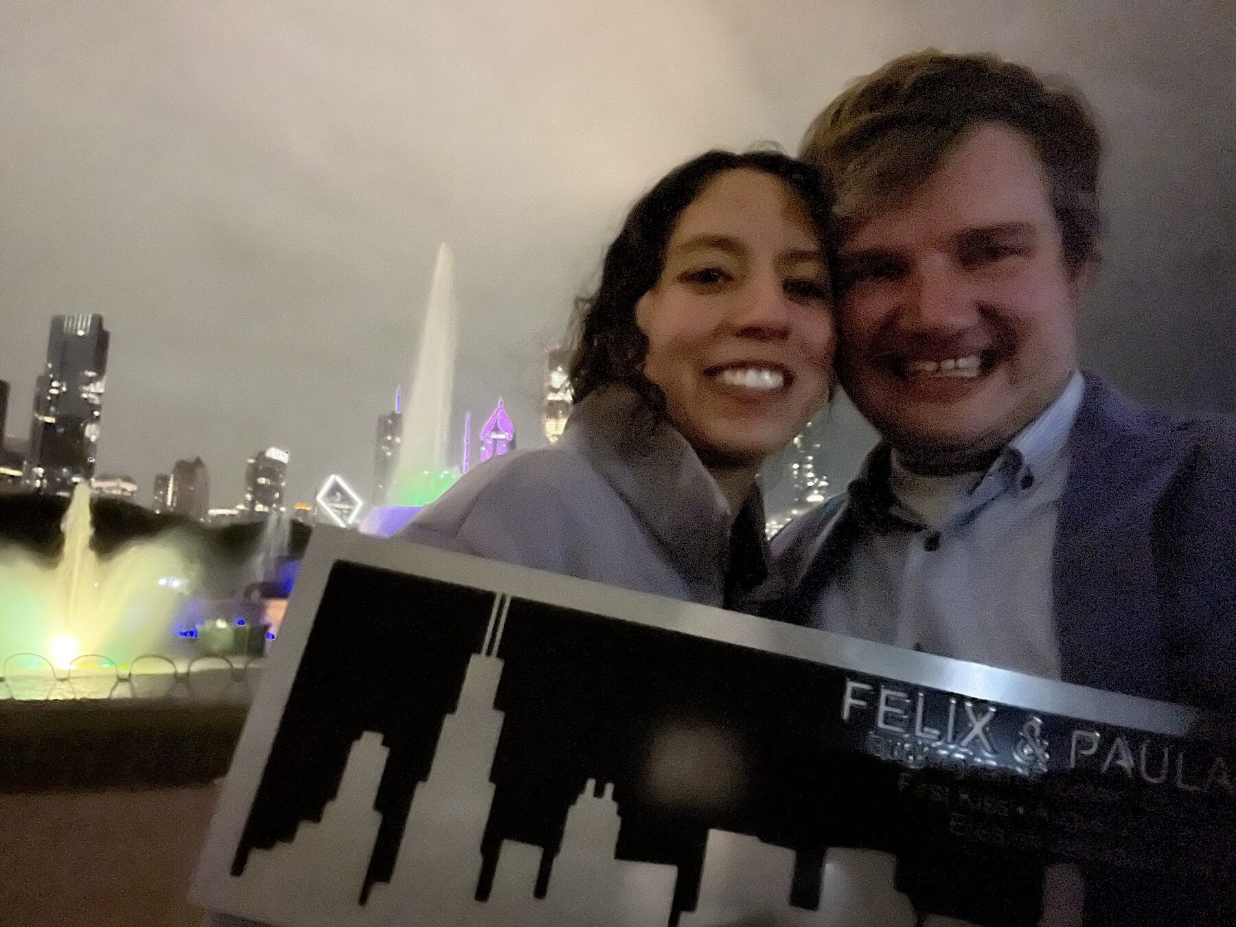 Paula and Felix celebrating their engagement at Buckingham Fountain